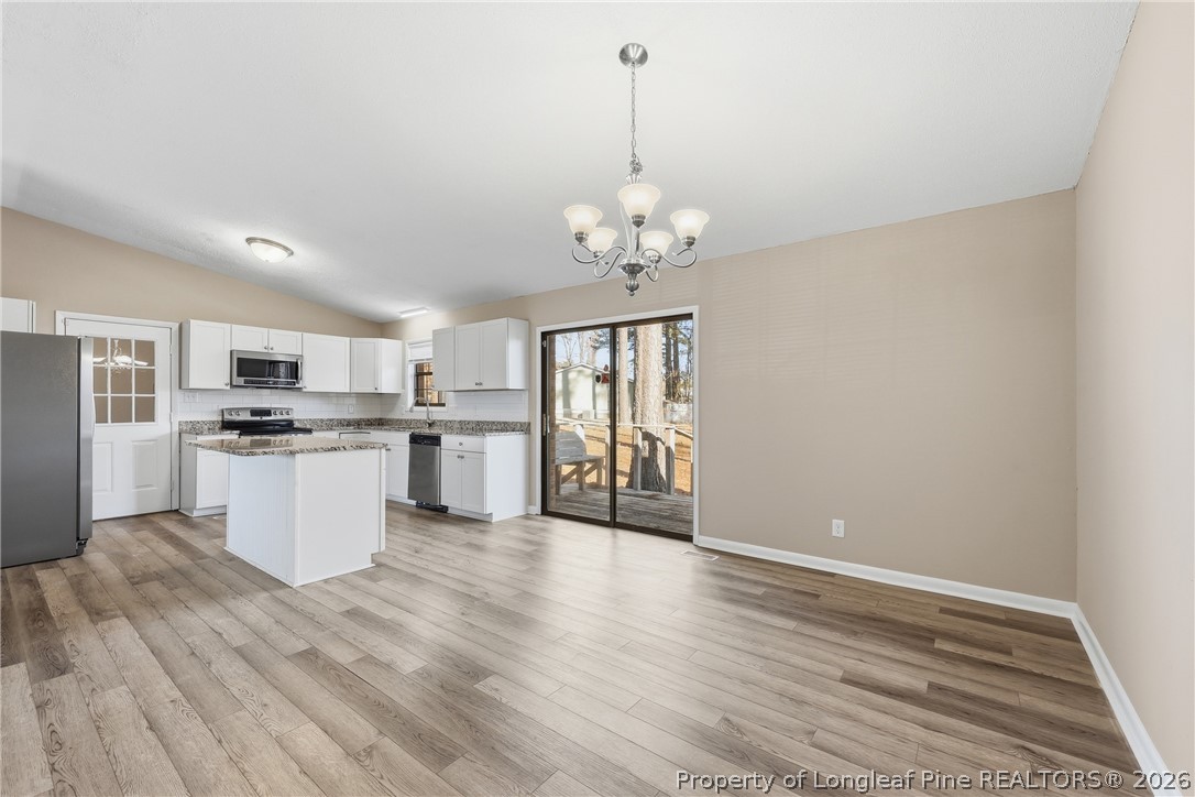 1304 Chara Court Spring Lake, NC 28390 - Photo 11 of 33 a view of kitchen with granite countertop cabinets and refrigerator