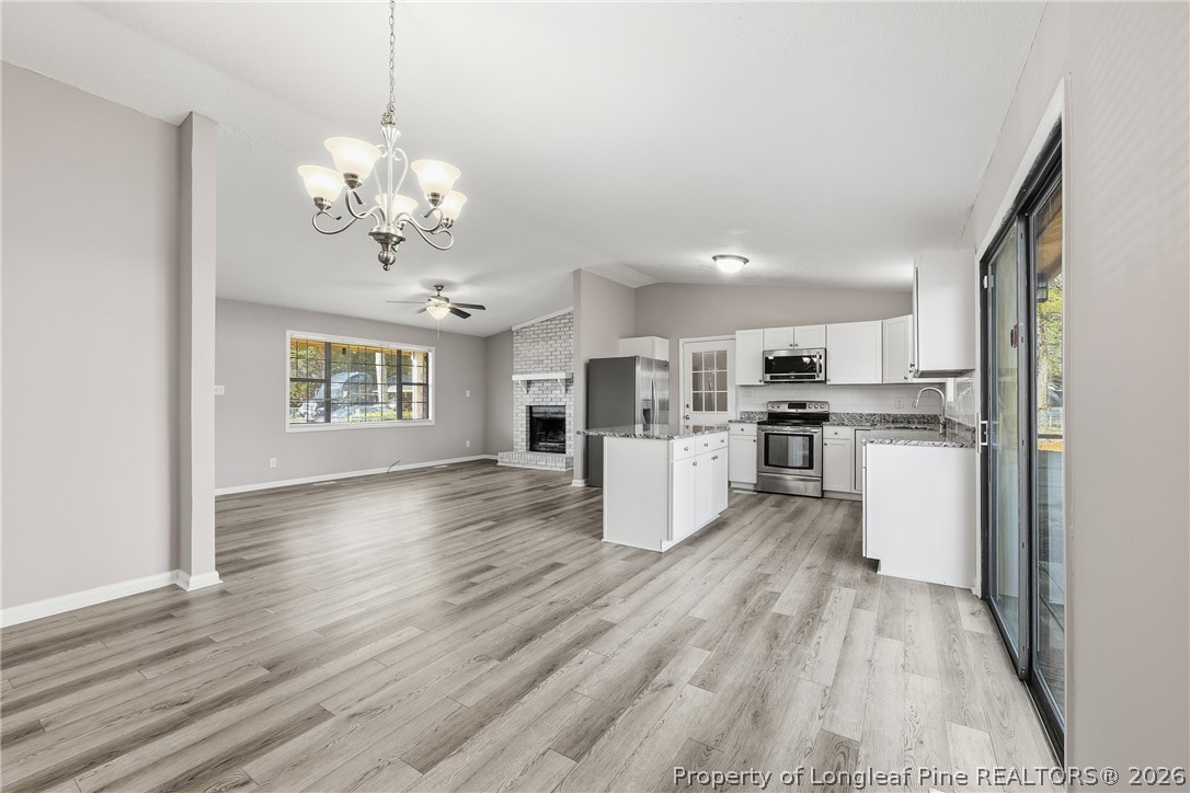 1304 Chara Court Spring Lake, NC 28390 - Photo 12 of 33 a view of kitchen with center island and stainless steel appliances
