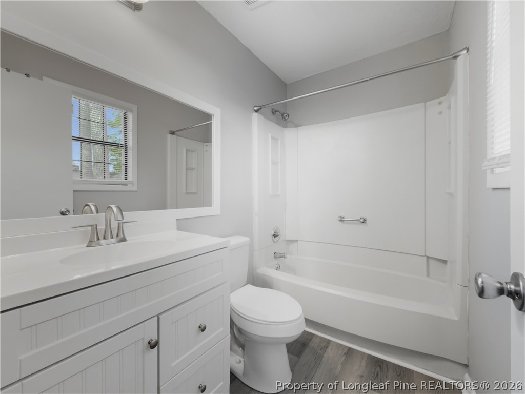 1304 Chara Court Spring Lake, NC 28390 - Photo 21 of 33 a bathroom with a sink a toilet and shower