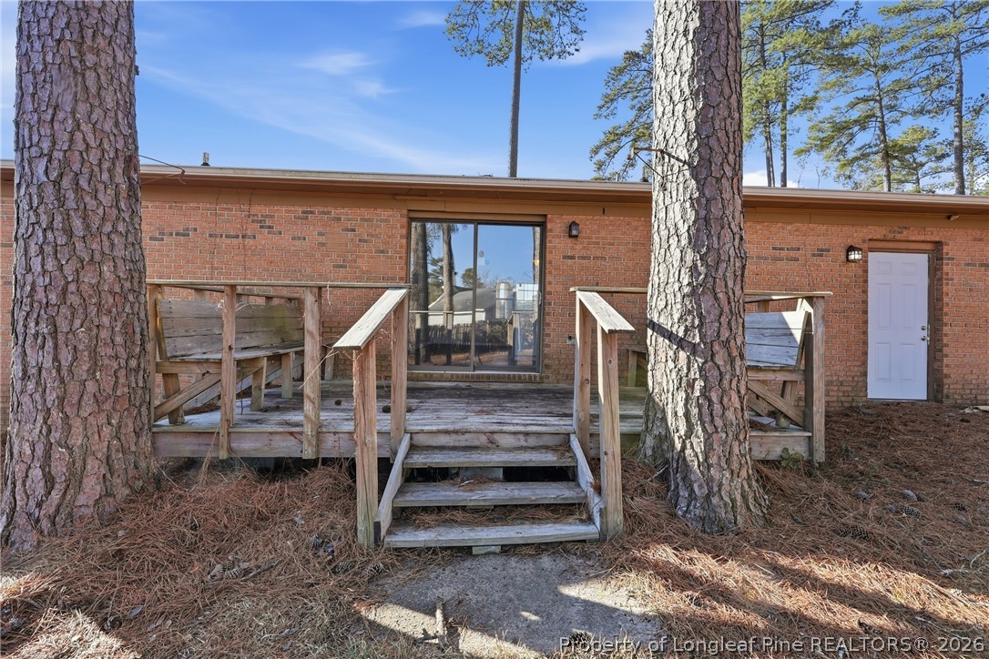 1304 Chara Court Spring Lake, NC 28390 - Photo 29 of 33 a view of a house with stairs and wooden fence