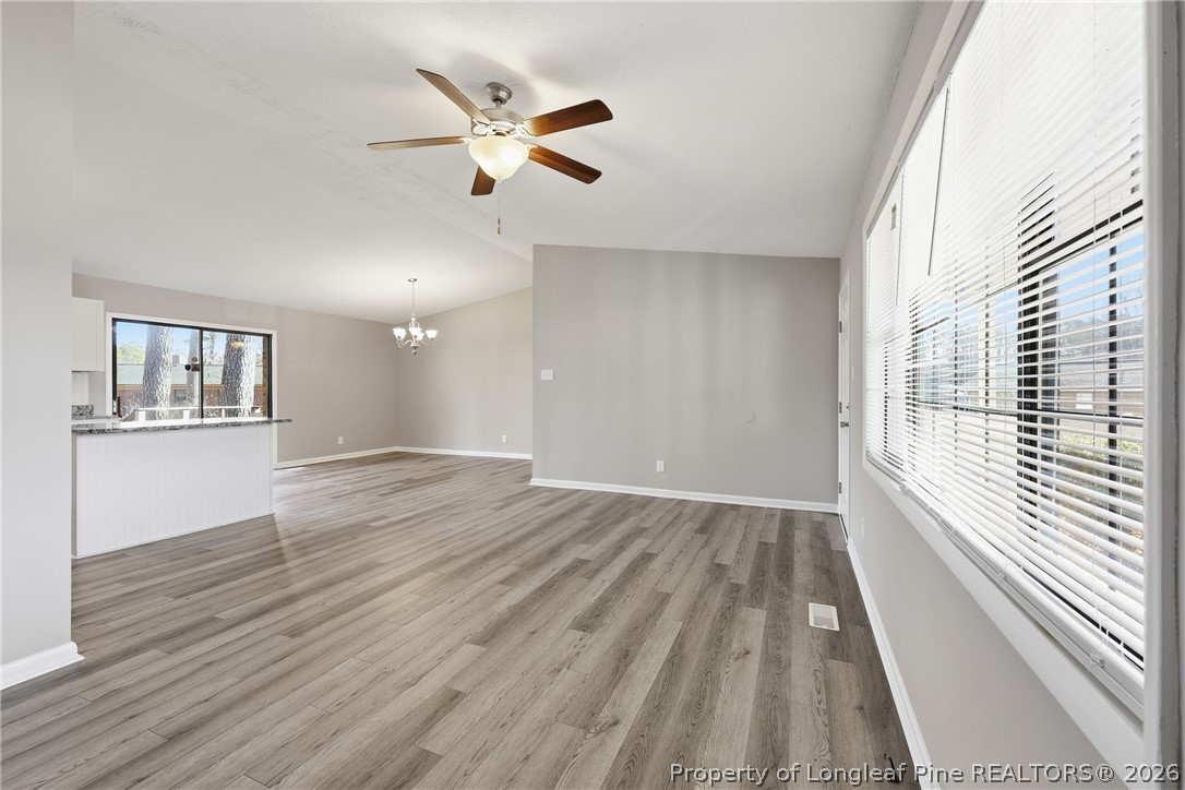 1304 Chara Court Spring Lake, NC 28390 - Photo 7 of 33 wooden floor in an empty room with a window