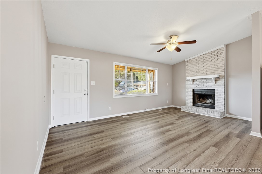 1304 Chara Court Spring Lake, NC 28390 - Photo 9 of 33 a view of an empty room with a window and fireplace