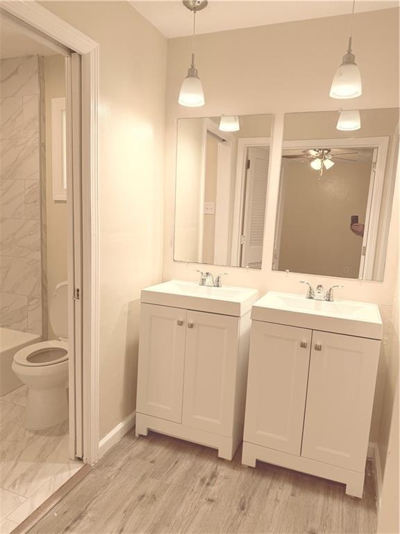 4707 Riverwood Circle Decatur, GA 30035 - Photo 15 of 17 a bathroom with a sink a toilet and a mirror