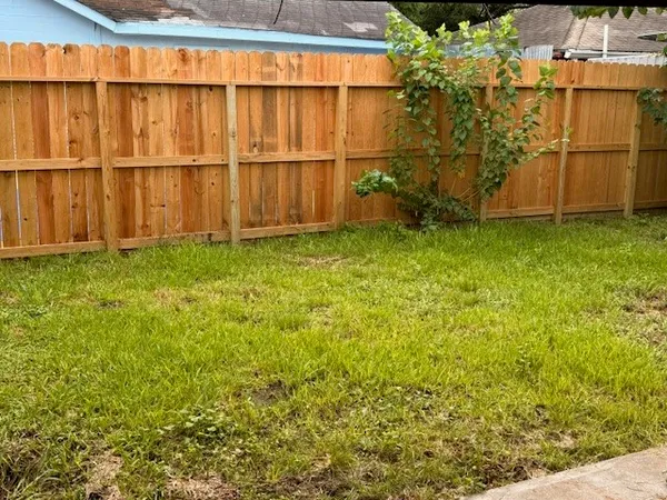 a view of a backyard of the house