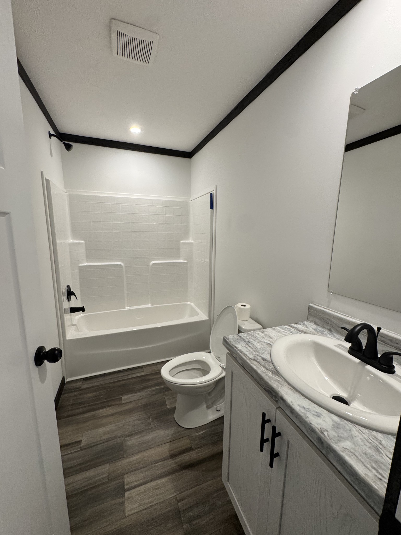 2066 Anderson Road Monterey, TN 38574 - Photo 8 of 18 a bathroom with a sink a toilet a mirror and shower