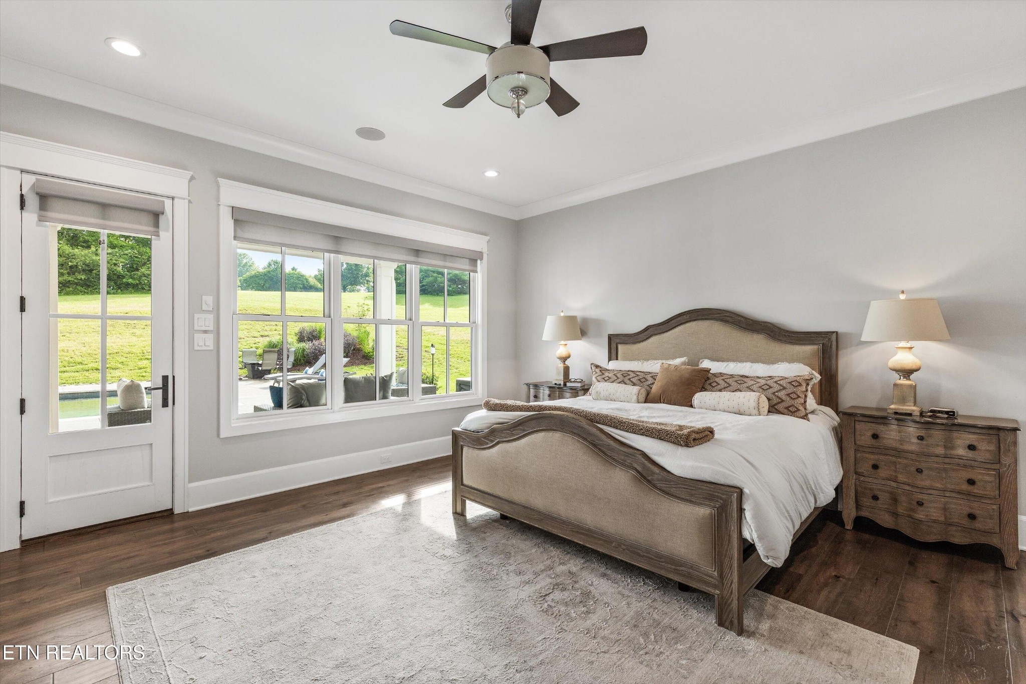 1748 Raulston Road Maryville, TN 37803 - Photo 19 of 59 a bedroom with a large bed and a chandelier fan