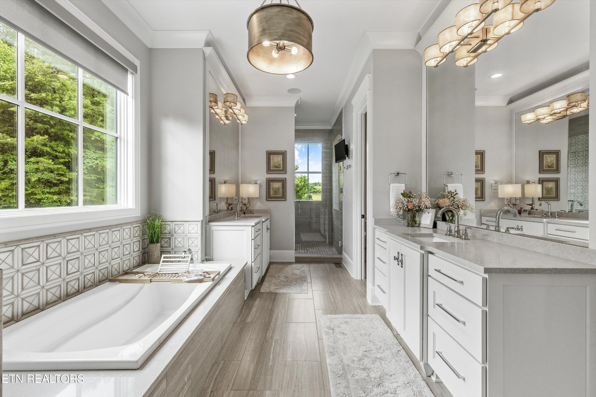 1748 Raulston Road Maryville, TN 37803 - Photo 20 of 59 a bathroom with a granite countertop sink mirror and a bathtub
