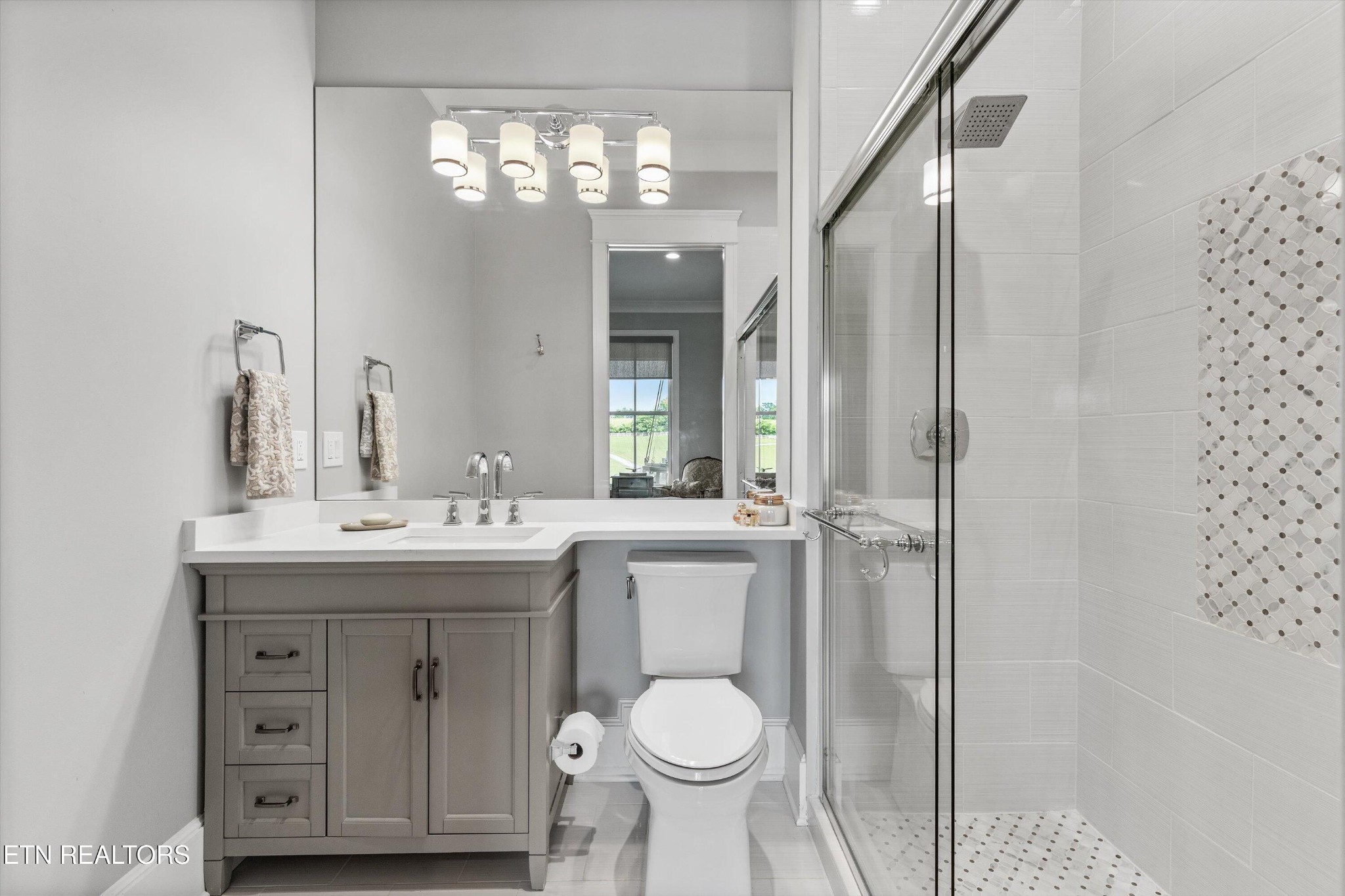 1748 Raulston Road Maryville, TN 37803 - Photo 24 of 59 a bathroom with a toilet sink and mirror
