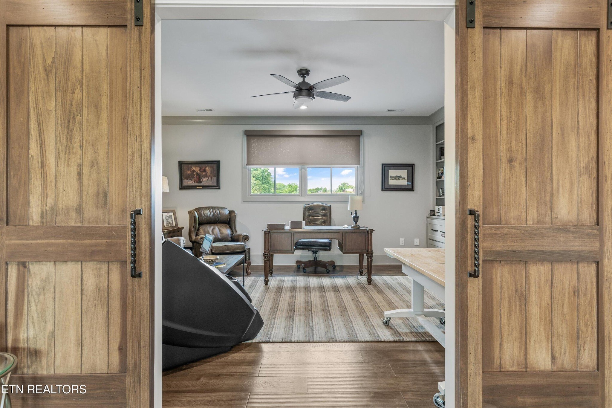 1748 Raulston Road Maryville, TN 37803 - Photo 29 of 59 a living room with furniture and a chandelier