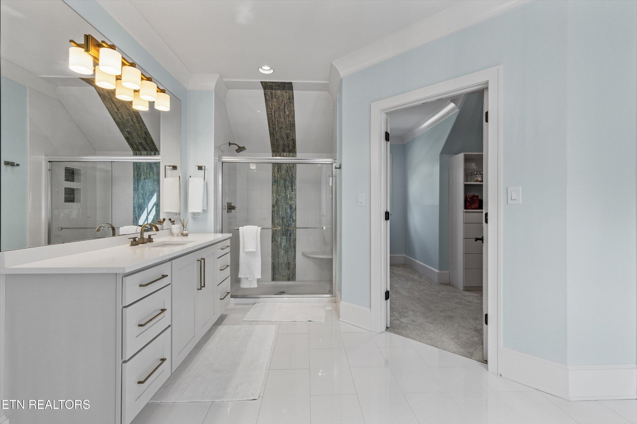 1748 Raulston Road Maryville, TN 37803 - Photo 36 of 59 a spacious bathroom with a shower sink and mirror