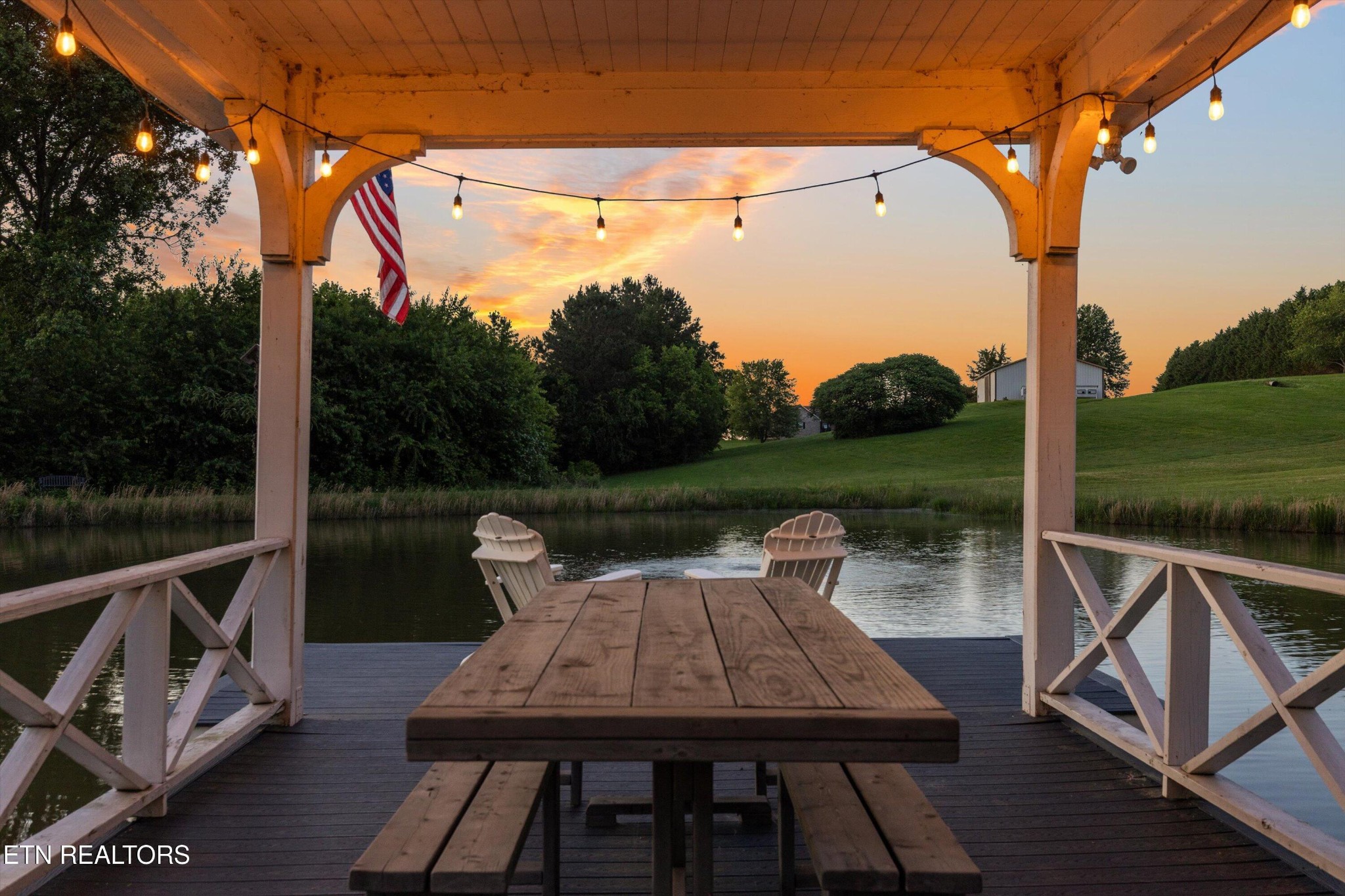 1748 Raulston Road Maryville, TN 37803 - Photo 44 of 59 a view of a patio with table and chairs and a barbeque grill with a small yard