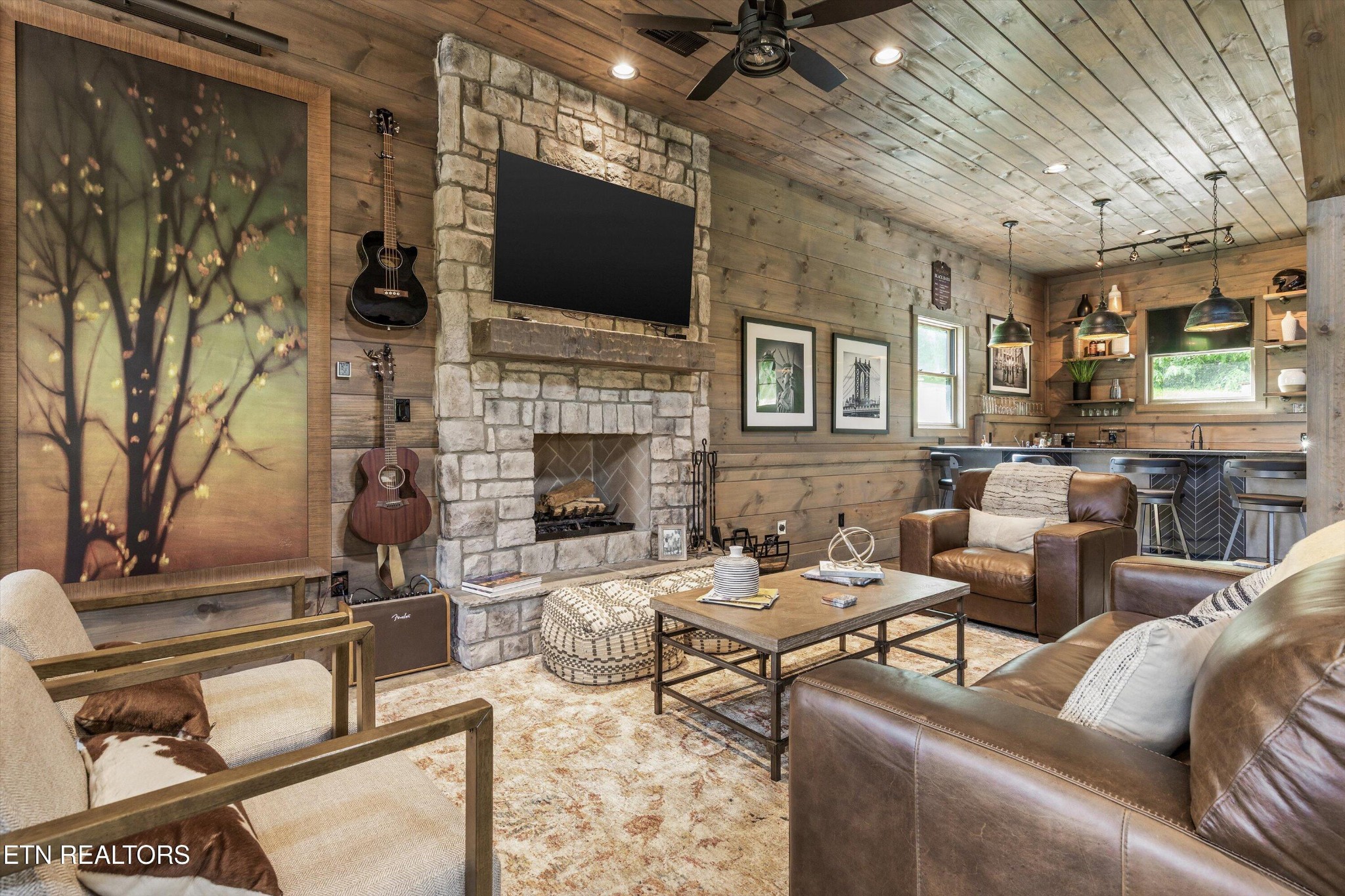 1748 Raulston Road Maryville, TN 37803 - Photo 48 of 59 a living room with furniture and a flat screen tv