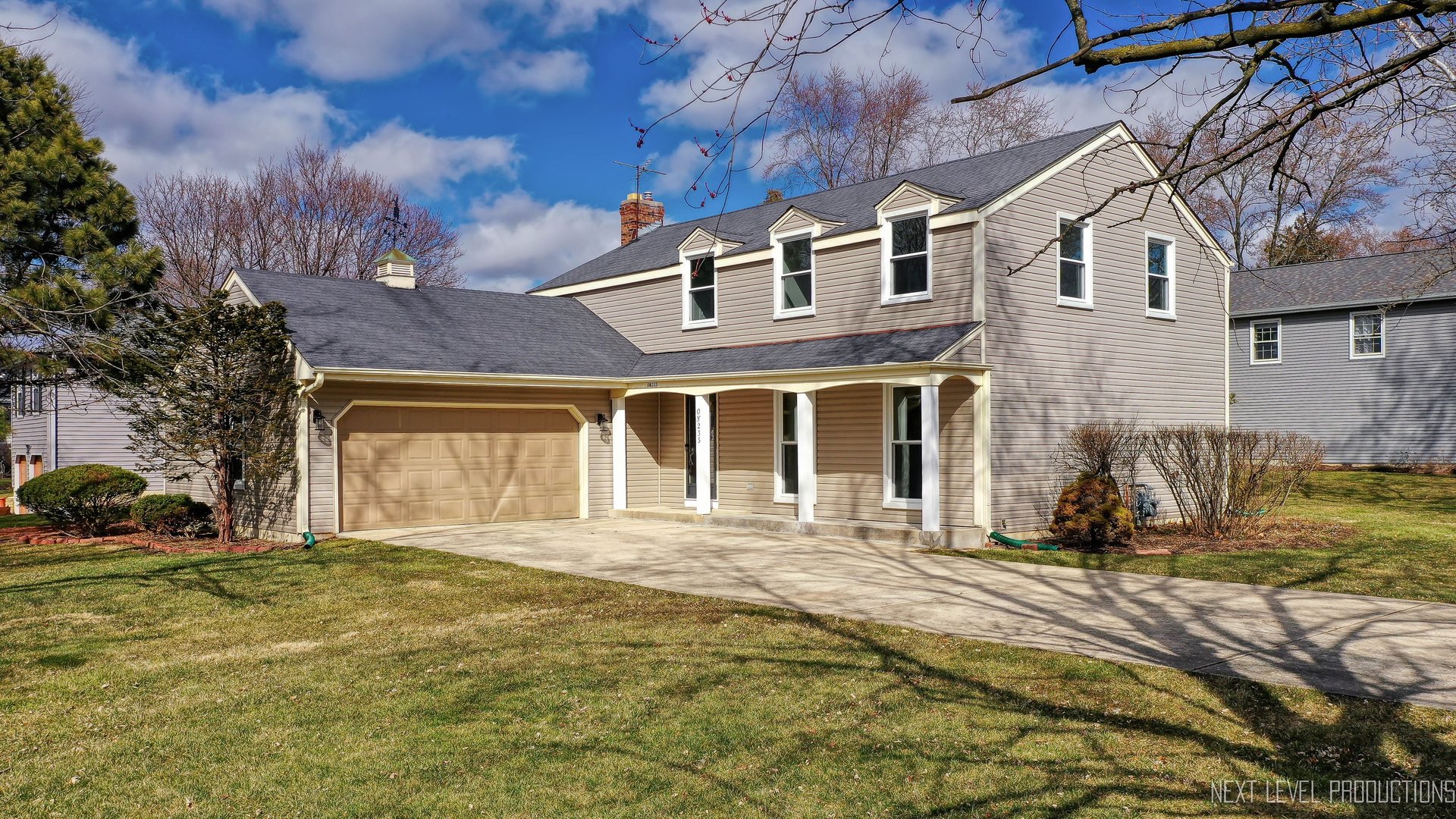 N235 Winfield Road Winfield, IL 60190 - Photo 1 of 37 a front view of a house with a yard