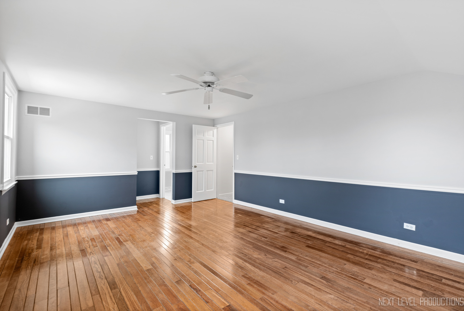 N235 Winfield Road Winfield, IL 60190 - Photo 13 of 37 a view of an empty room with wooden floor