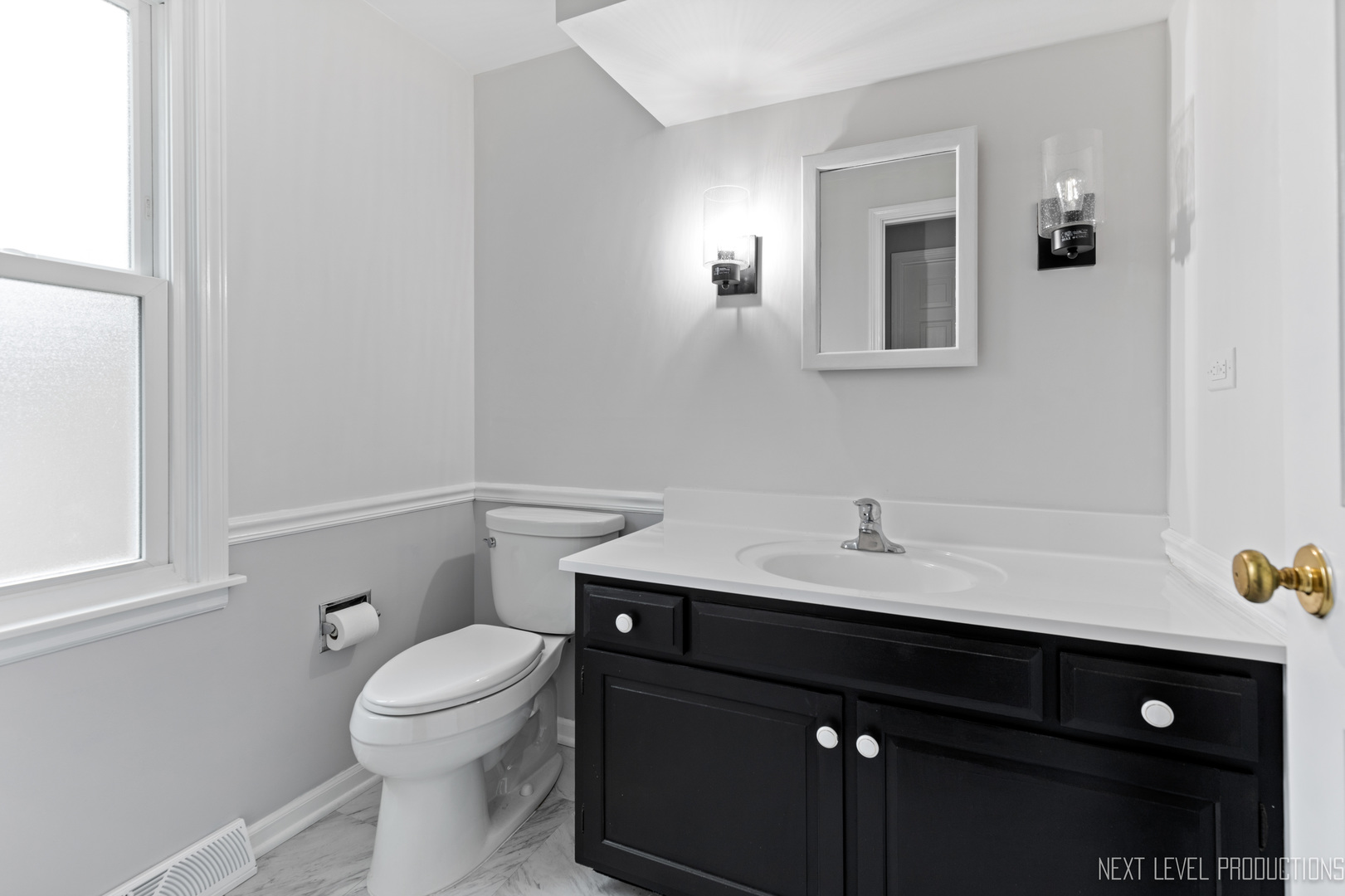 N235 Winfield Road Winfield, IL 60190 - Photo 14 of 37 a bathroom with a sink a toilet and mirror