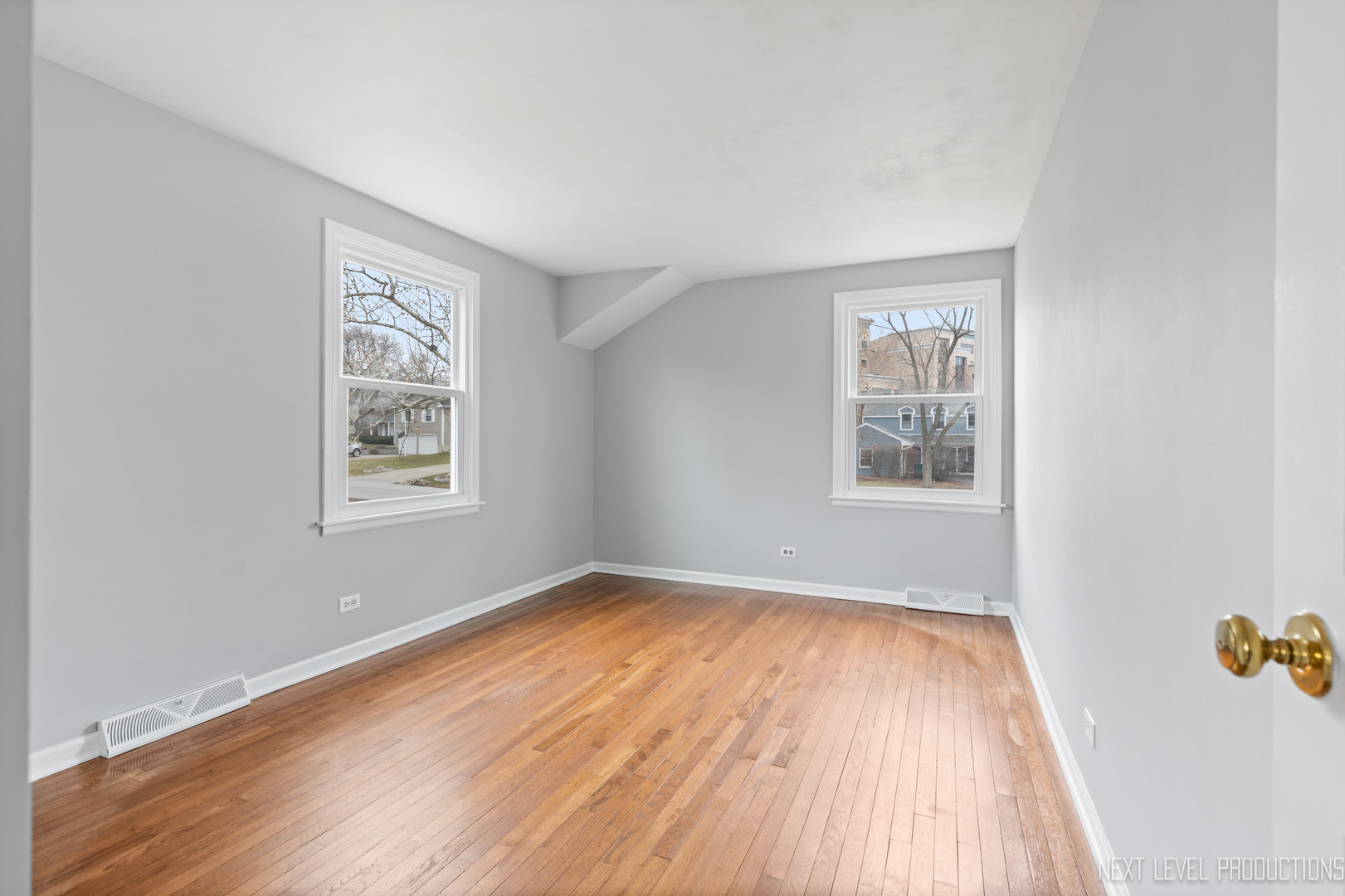 N235 Winfield Road Winfield, IL 60190 - Photo 18 of 37 wooden floor in an empty room with a window