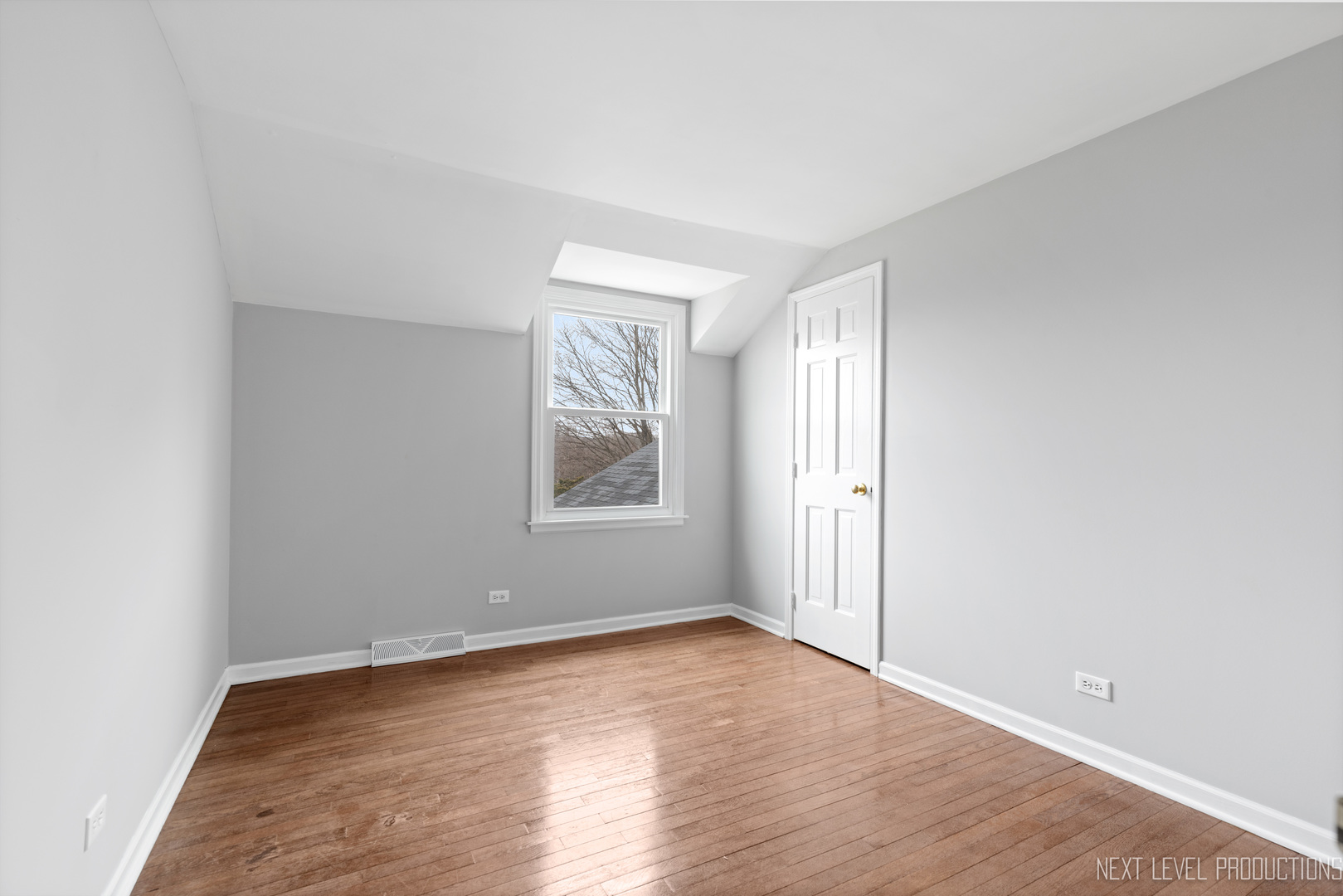 N235 Winfield Road Winfield, IL 60190 - Photo 20 of 37 an empty room with wooden floor and windows