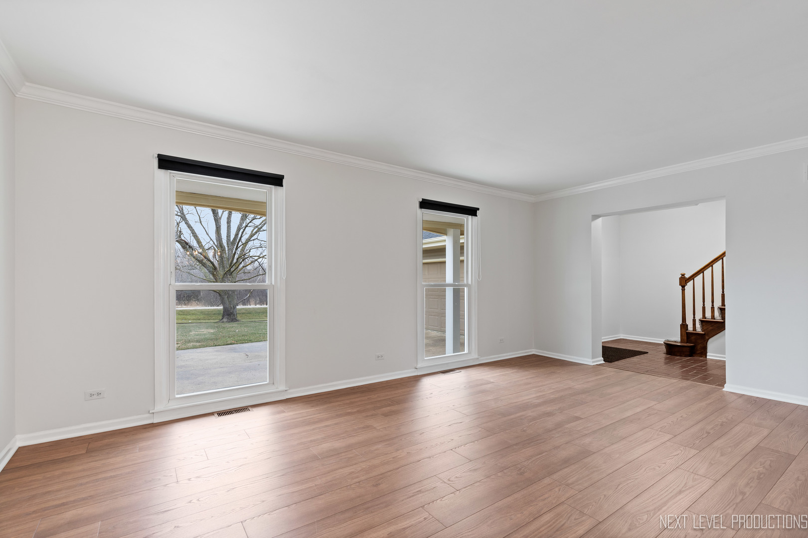 N235 Winfield Road Winfield, IL 60190 - Photo 22 of 37 a view of an empty room with wooden floor and a window