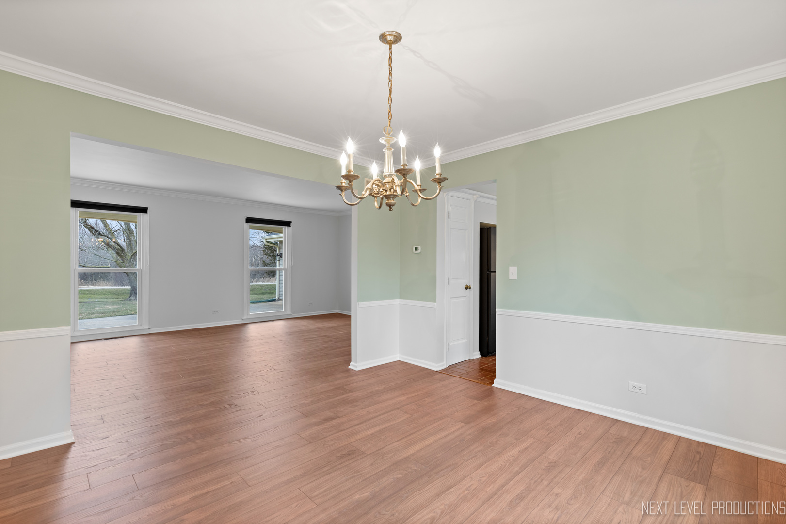 N235 Winfield Road Winfield, IL 60190 - Photo 23 of 37 a view of a room with wooden floor and chandelier