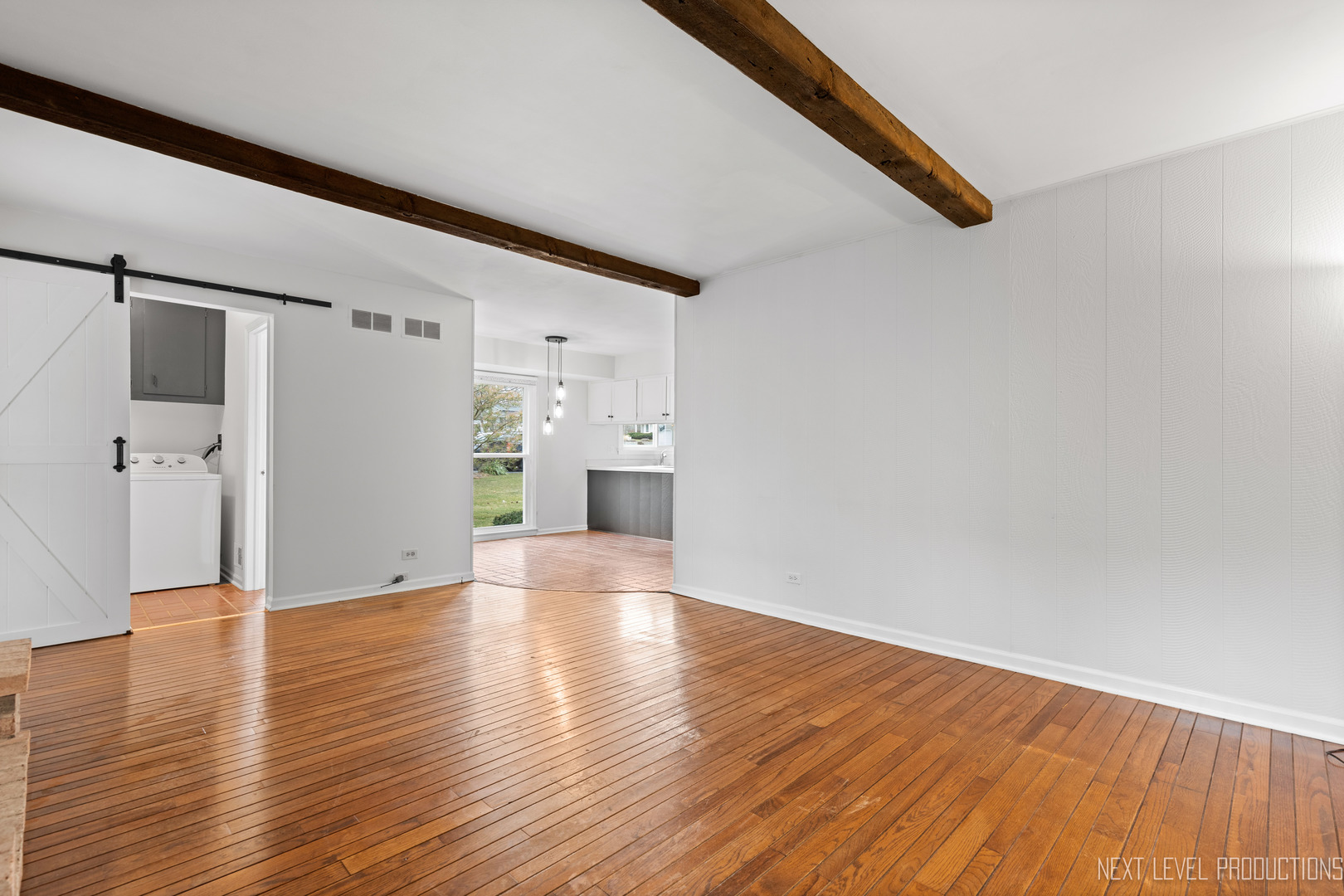 N235 Winfield Road Winfield, IL 60190 - Photo 24 of 37 a view of a livingroom with wooden floor and a ceiling fan