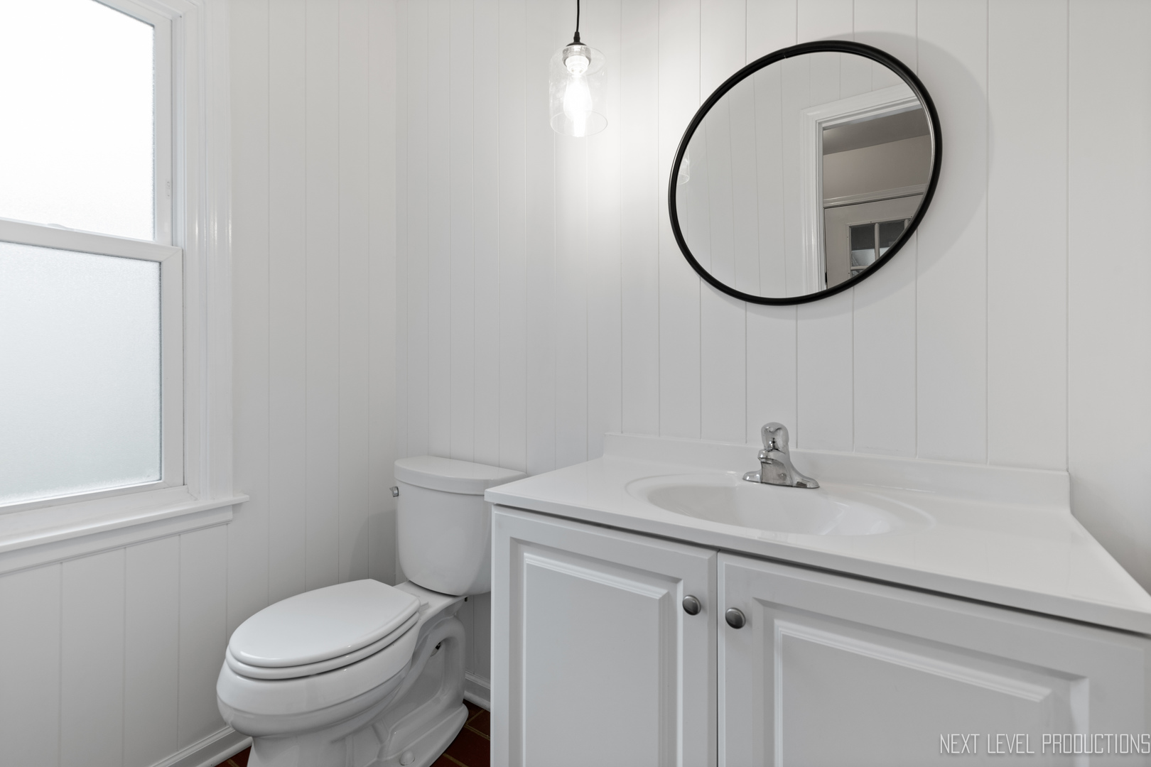 N235 Winfield Road Winfield, IL 60190 - Photo 26 of 37 a bathroom with a sink a toilet and a mirror
