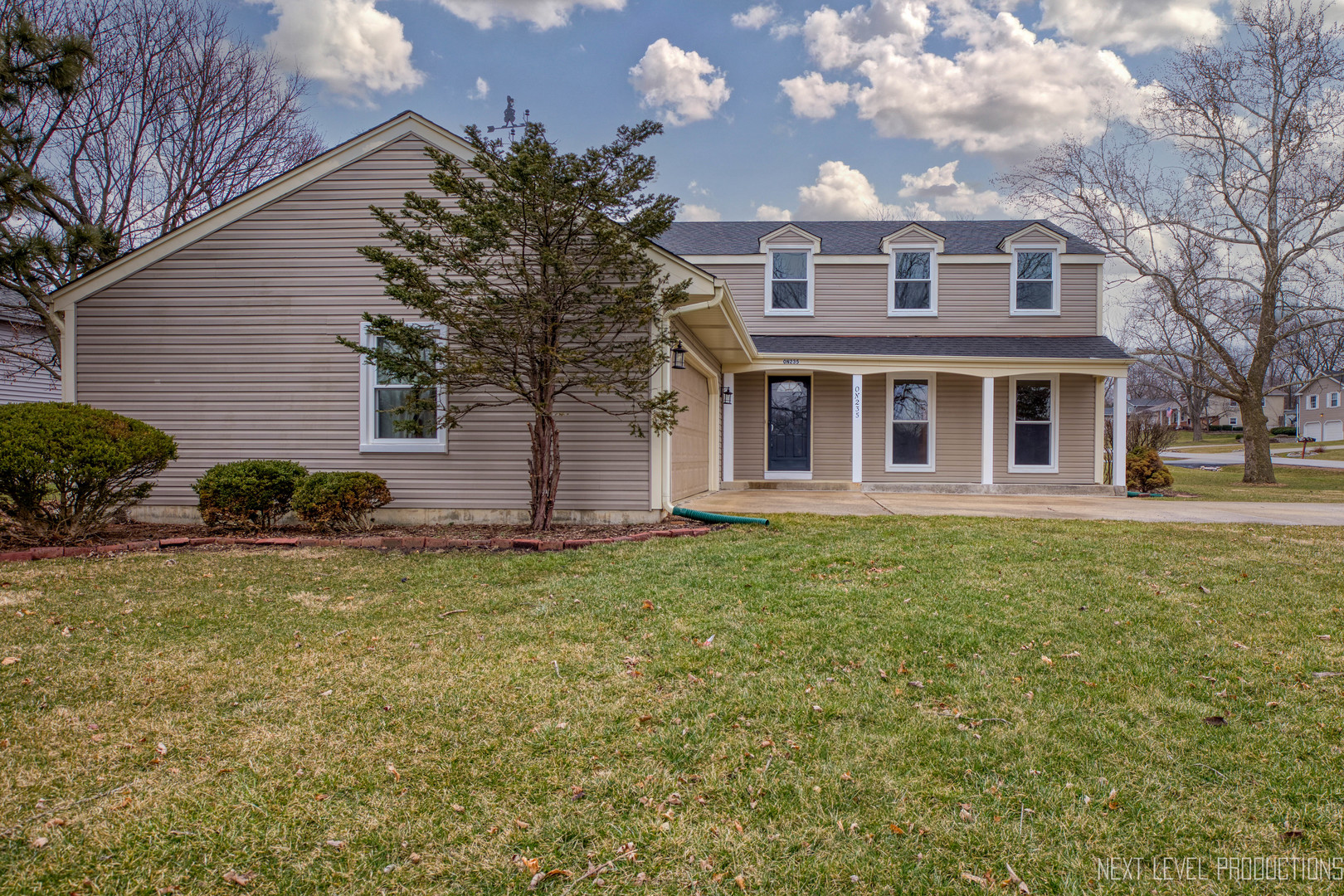 N235 Winfield Road Winfield, IL 60190 - Photo 29 of 37 a front view of a house with garden