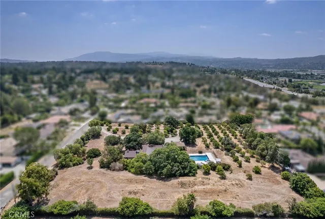 an aerial view of a city and mountain view in back