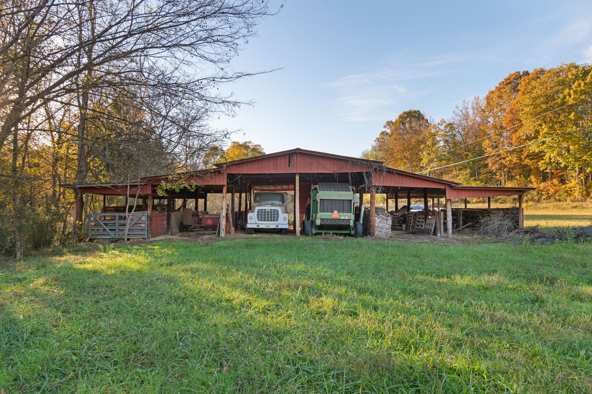 0 Short Creek Road Linden, TN 37096 - Photo 29 of 49 a view of a house with a yard table and chairs under an umbrella