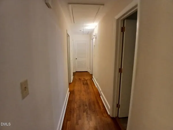 a view of a bathroom from a hallway