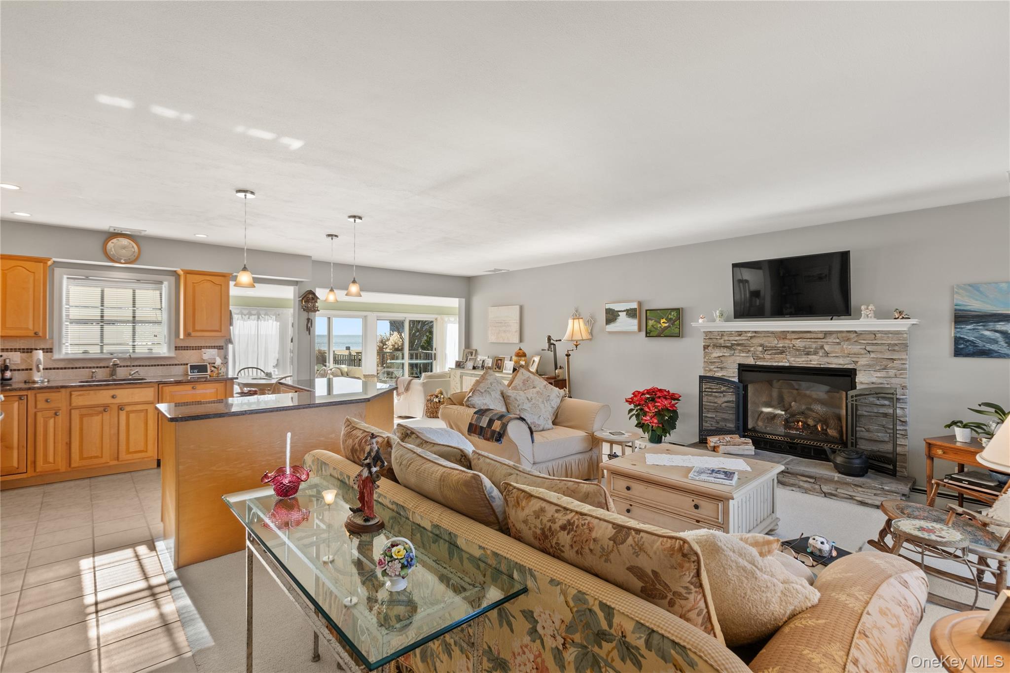 5 A Bay Road East Patchogue, NY 11772 - Photo 14 of 27 Living area featuring a fireplace and light tile patterned floors