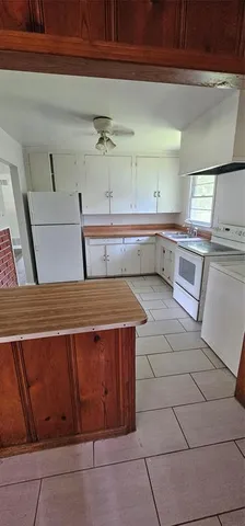 a kitchen with stainless steel appliances a sink and cabinets