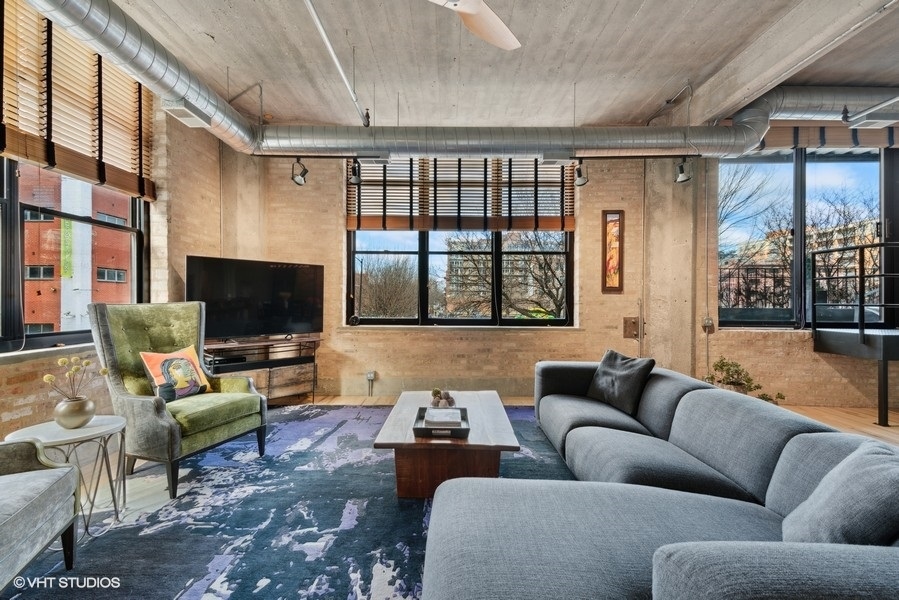 850 West Adams Street, Unit 2C Chicago, IL 60607 - Photo 21 of 55 a living room with furniture or couch and a flat screen tv