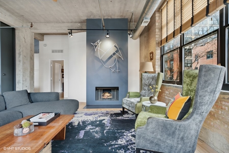 850 West Adams Street, Unit 2C Chicago, IL 60607 - Photo 24 of 55 a living room with furniture and a fireplace