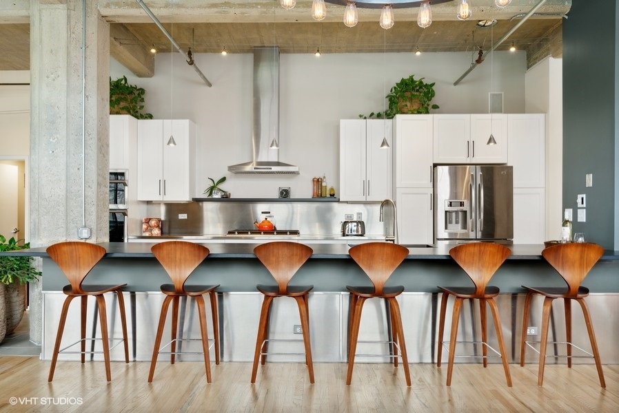 850 West Adams Street, Unit 2C Chicago, IL 60607 - Photo 10 of 55 a view of kitchen with furniture and wooden floor