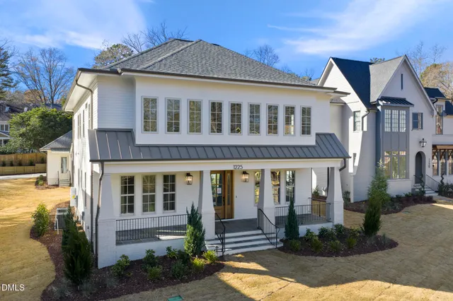 a kitchen with sink cabinets and living room