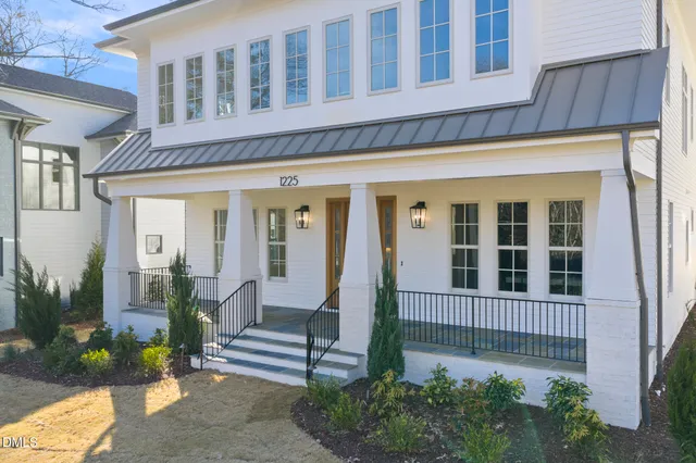 a living room with furniture wooden floor and a fireplace