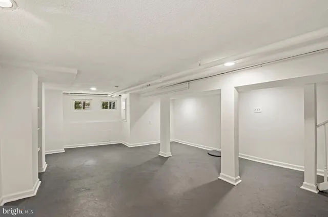 a view of an empty room with glass door