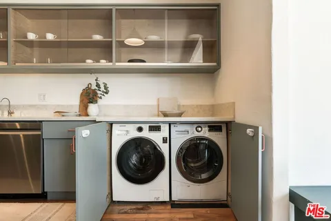 a utility room with closet dryer and washer