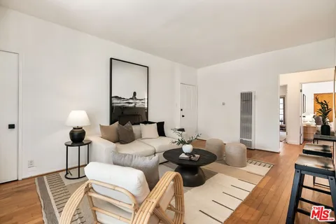 a living room with furniture and a lamp