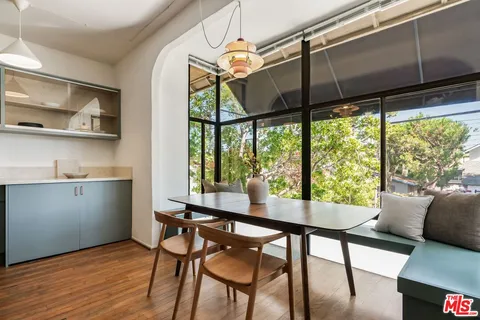 a view of a dining room with furniture window and outside view