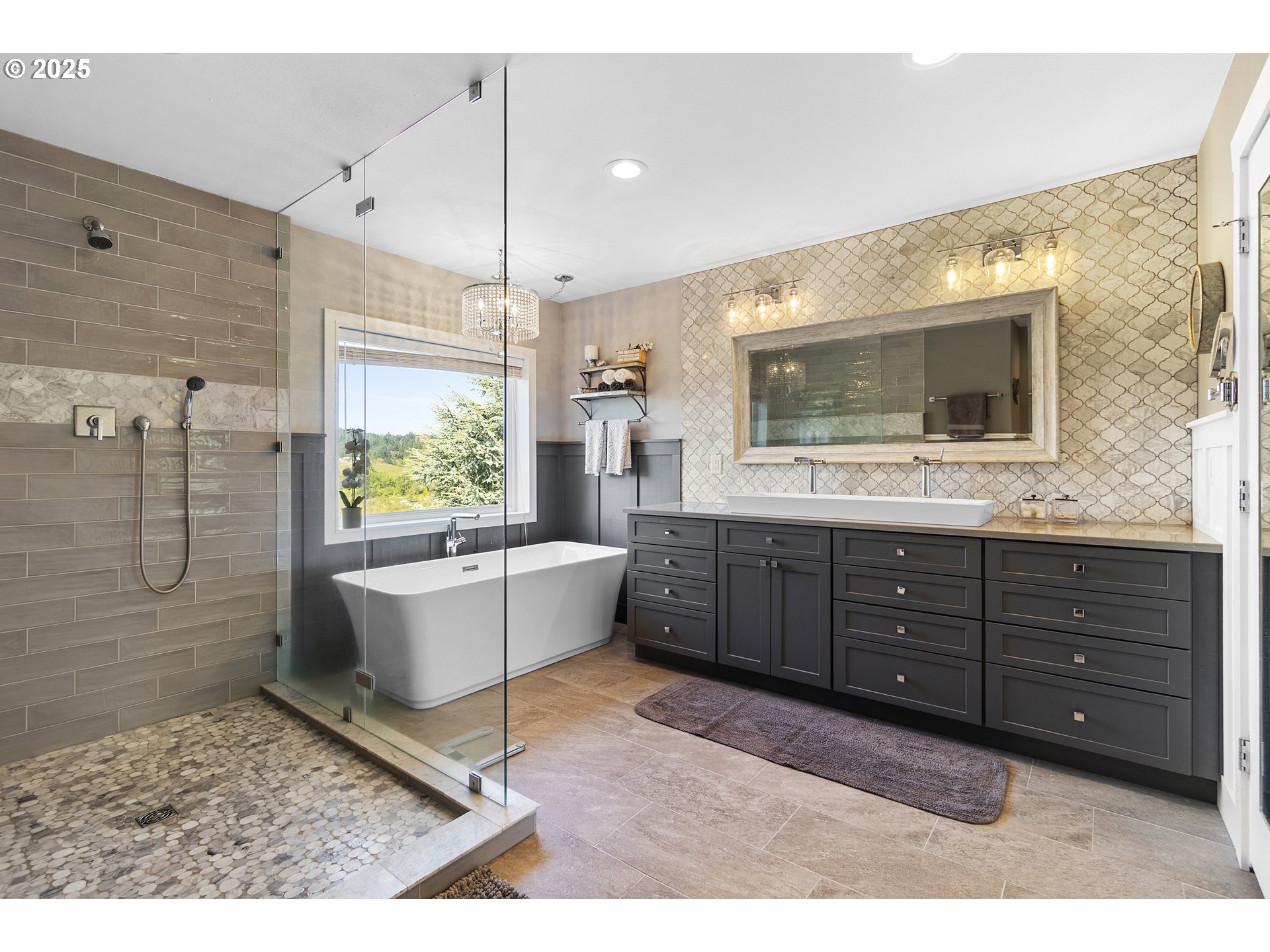 13631 Northeast Kinney Road Newberg, OR 97132 - Photo 19 of 48 a spacious bathroom with a granite countertop sink mirror and bathtub