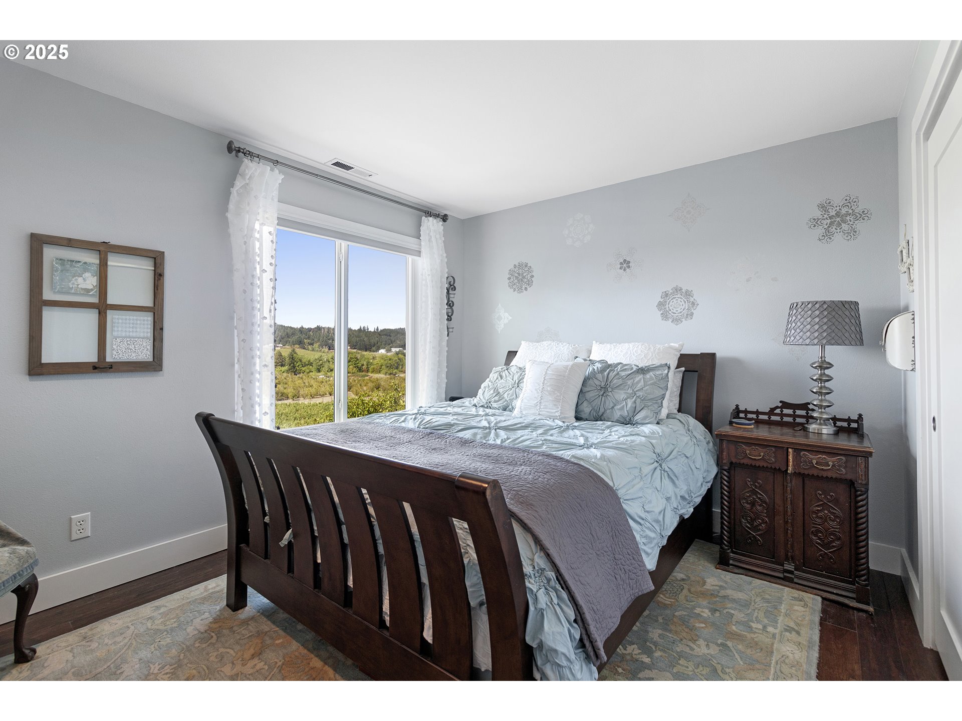 13631 Northeast Kinney Road Newberg, OR 97132 - Photo 23 of 48 a bedroom with a bed and a window