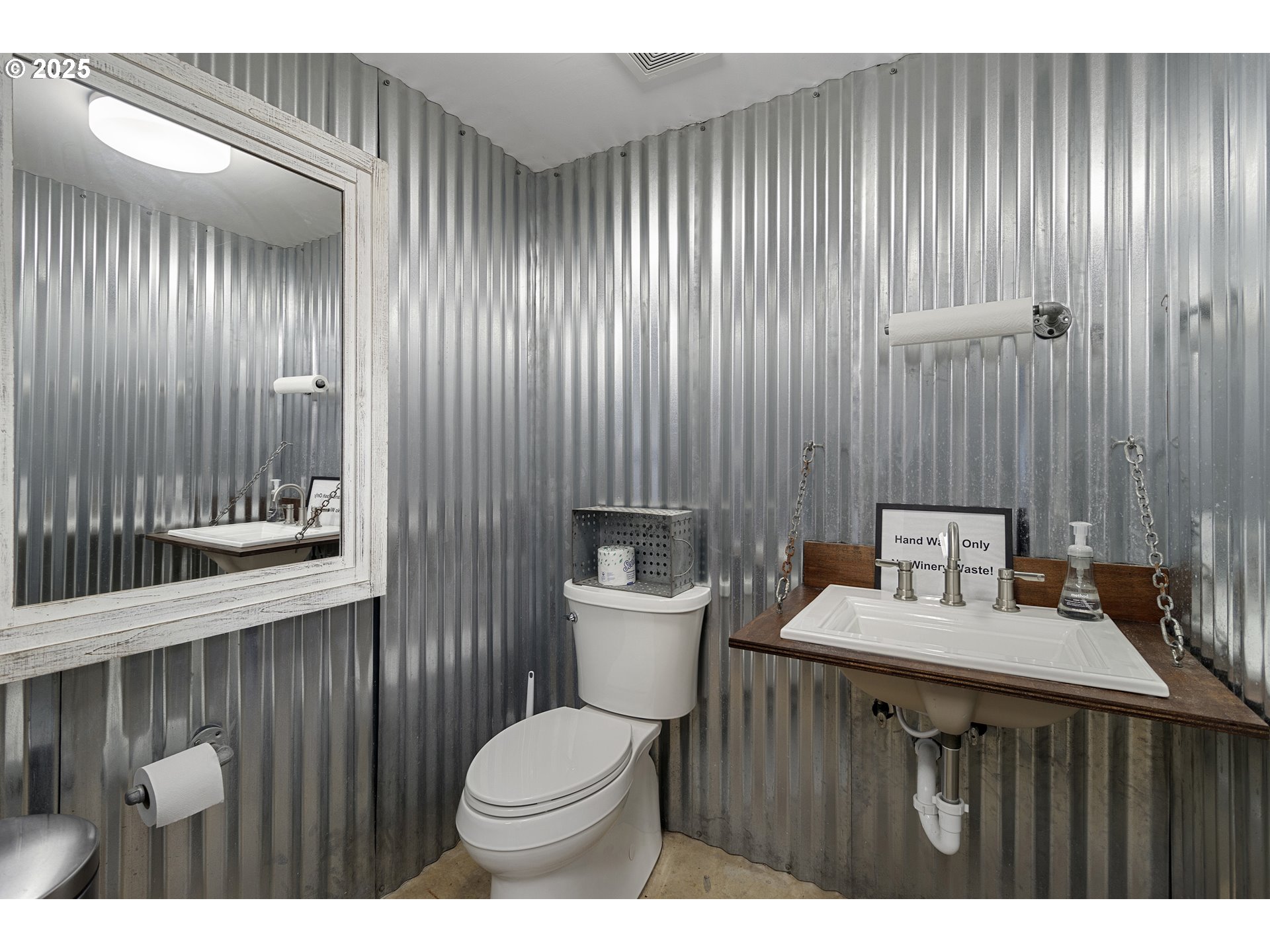 13631 Northeast Kinney Road Newberg, OR 97132 - Photo 35 of 48 a bathroom with a sink a toilet and mirror
