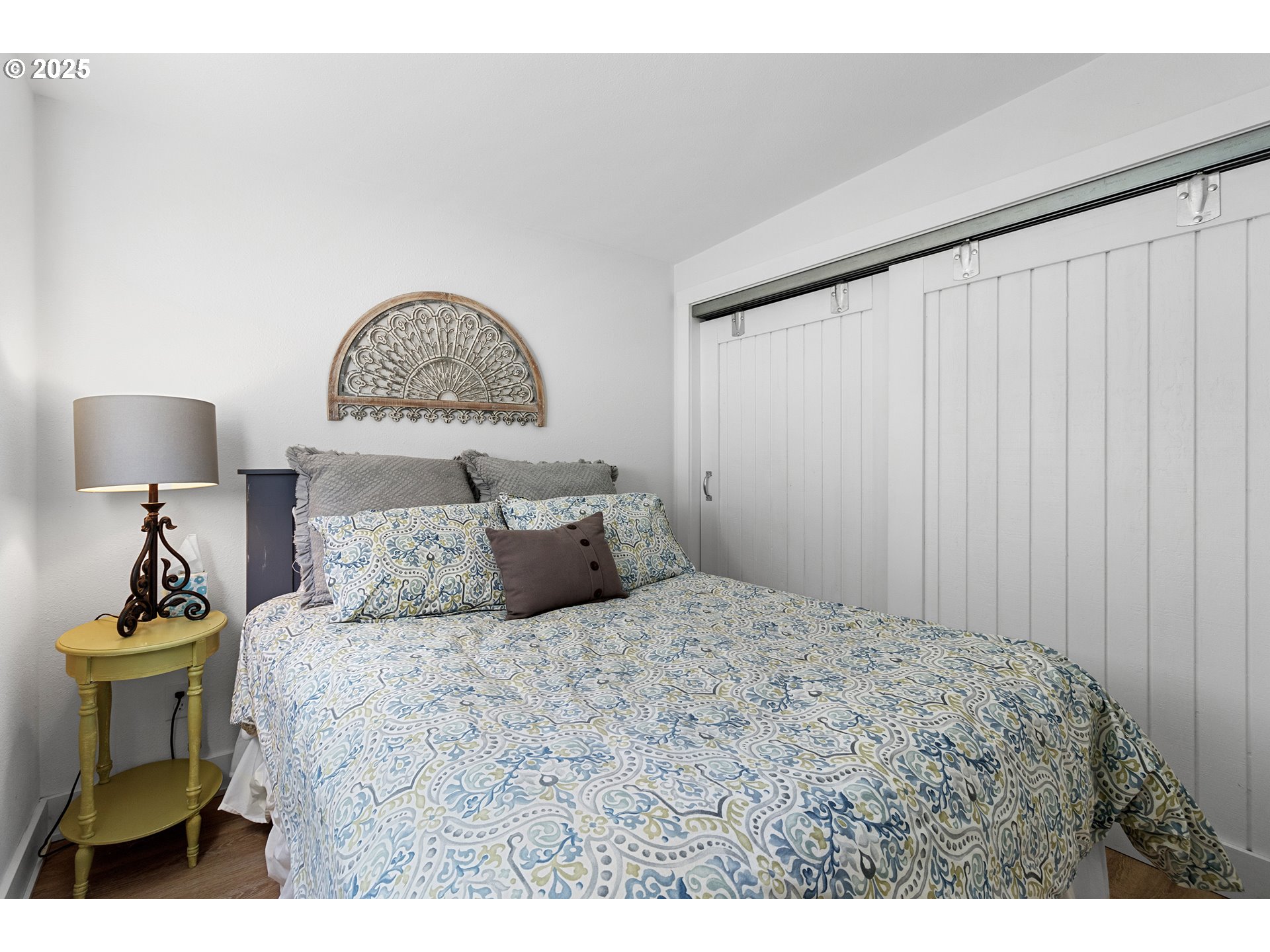 13631 Northeast Kinney Road Newberg, OR 97132 - Photo 38 of 48 a bedroom with a bed and a painting on the wall