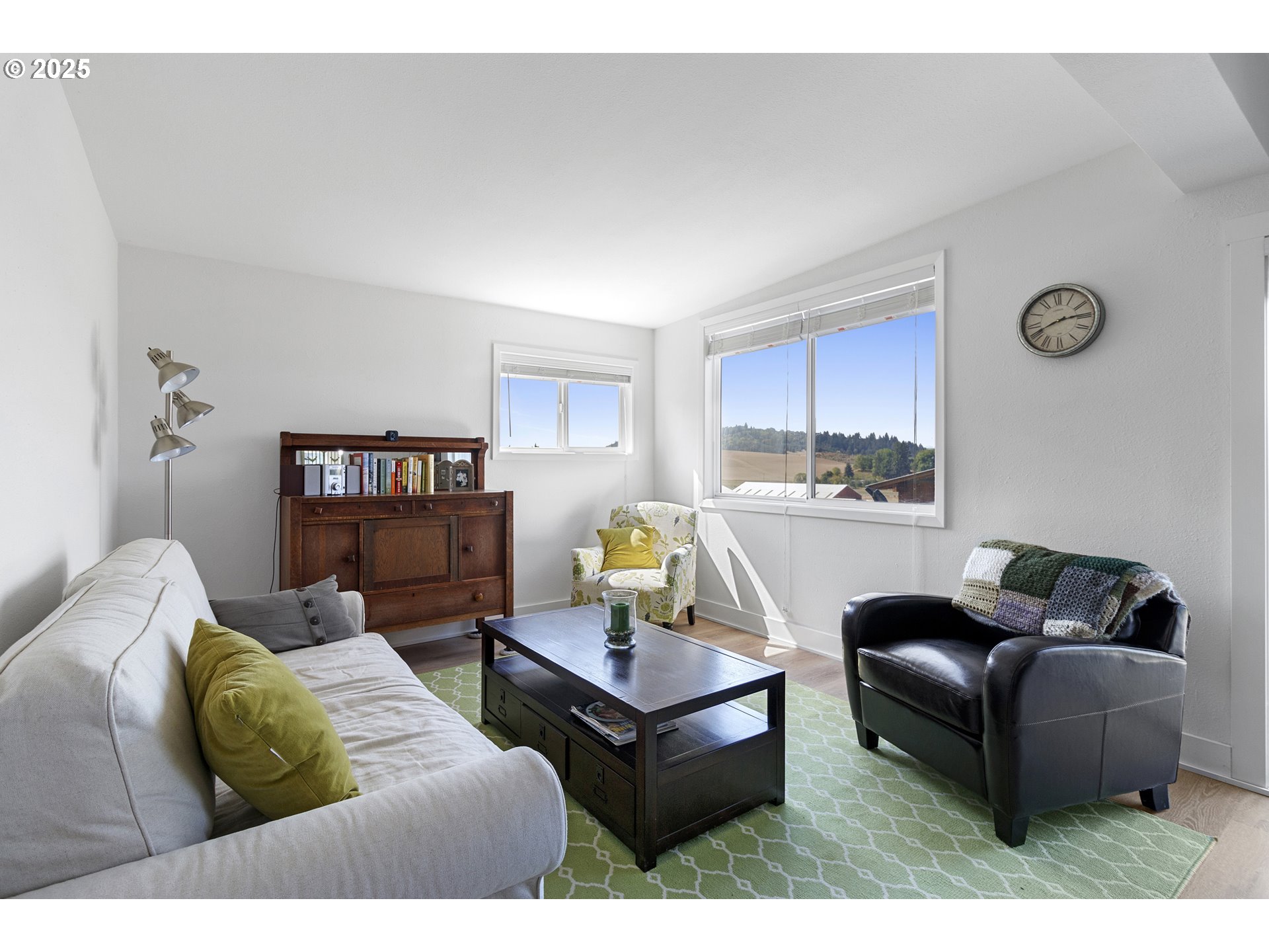 13631 Northeast Kinney Road Newberg, OR 97132 - Photo 39 of 48 a living room with furniture and a wooden floor