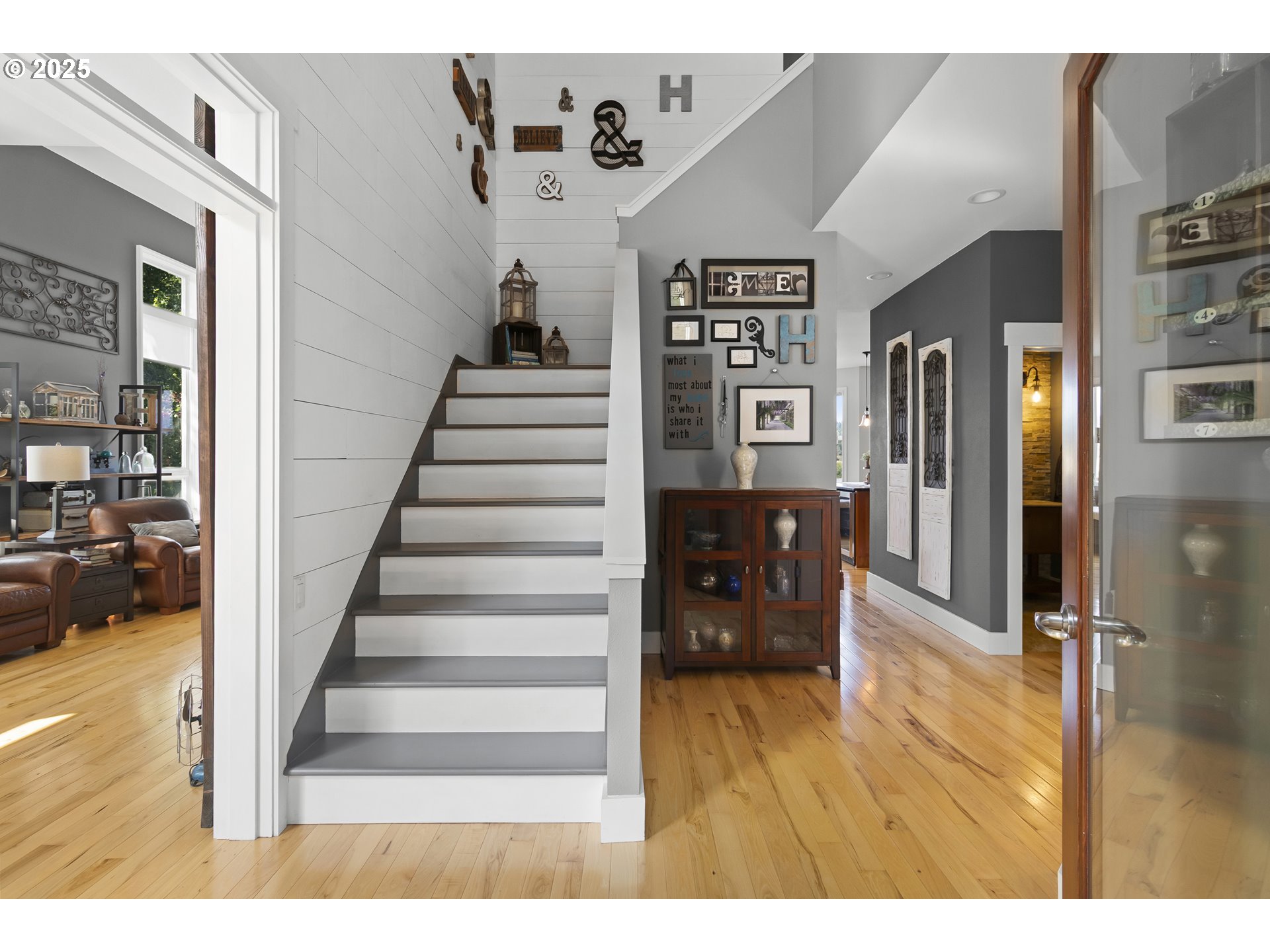 13631 Northeast Kinney Road Newberg, OR 97132 - Photo 4 of 48 a view of a livingroom with furniture and stairs