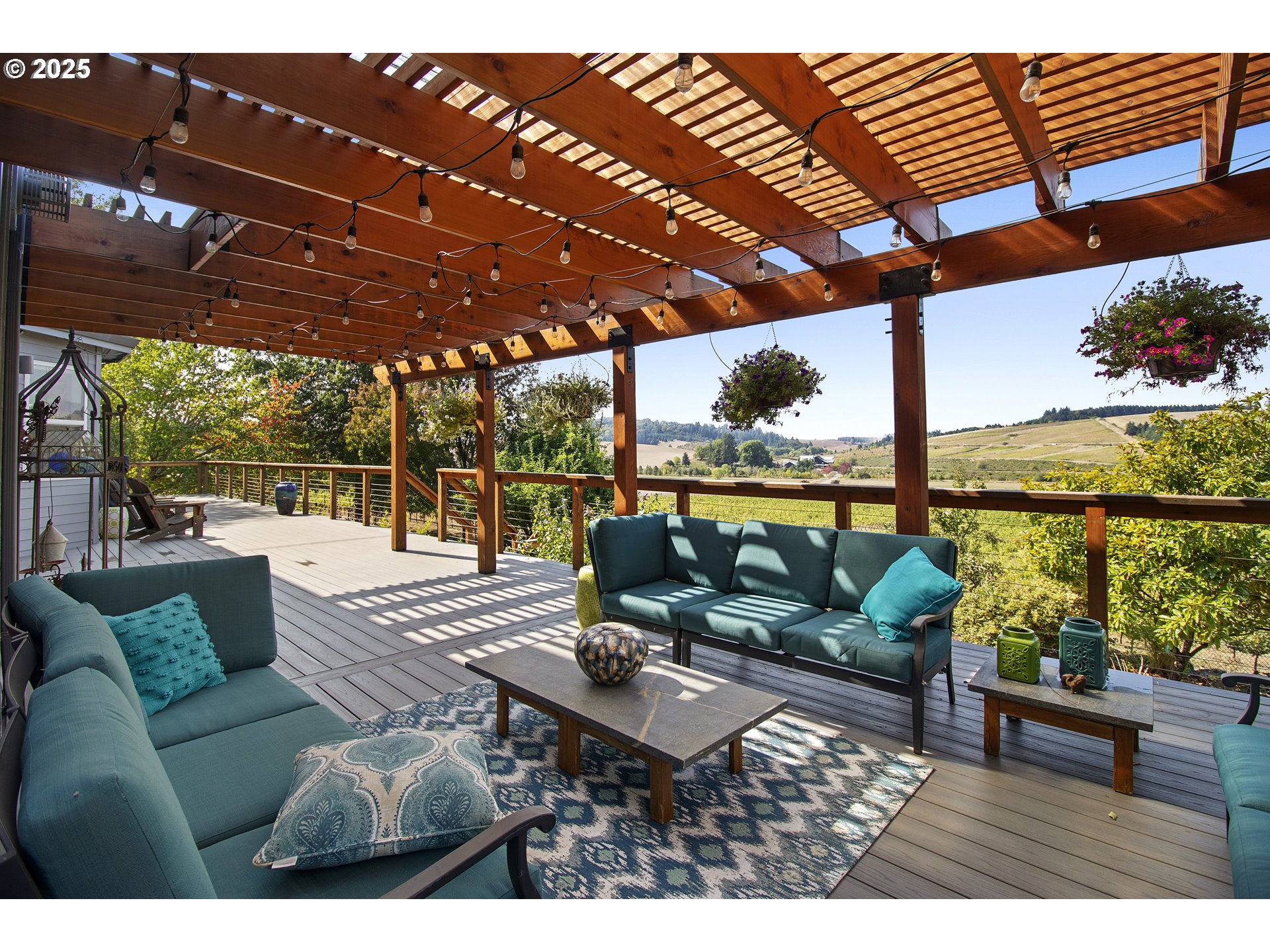13631 Northeast Kinney Road Newberg, OR 97132 - Photo 45 of 48 a roof deck with outdoor seating and city view