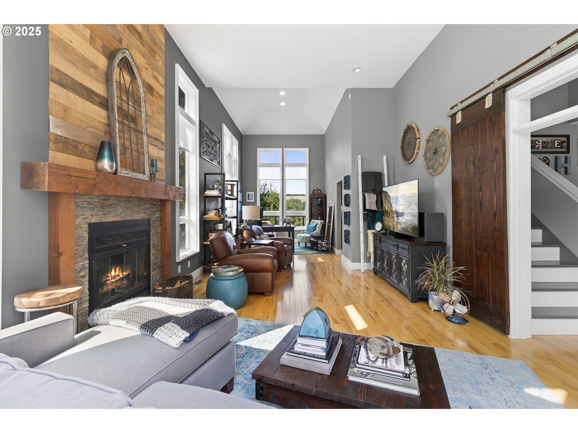 13631 Northeast Kinney Road Newberg, OR 97132 - Photo 5 of 48 a living room with furniture a fireplace and a flat screen tv