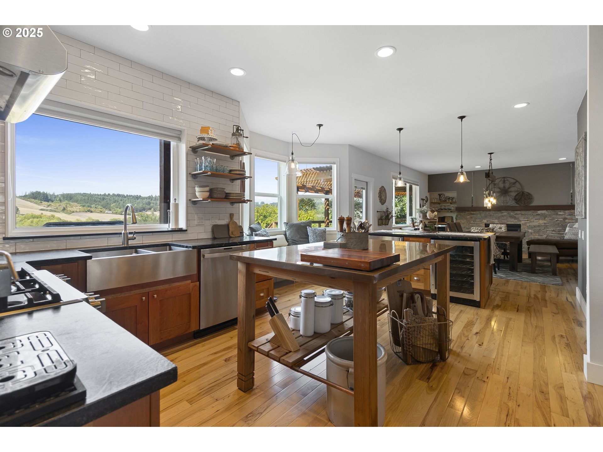 13631 Northeast Kinney Road Newberg, OR 97132 - Photo 8 of 48 a kitchen with stainless steel appliances kitchen island granite countertop a sink and cabinets