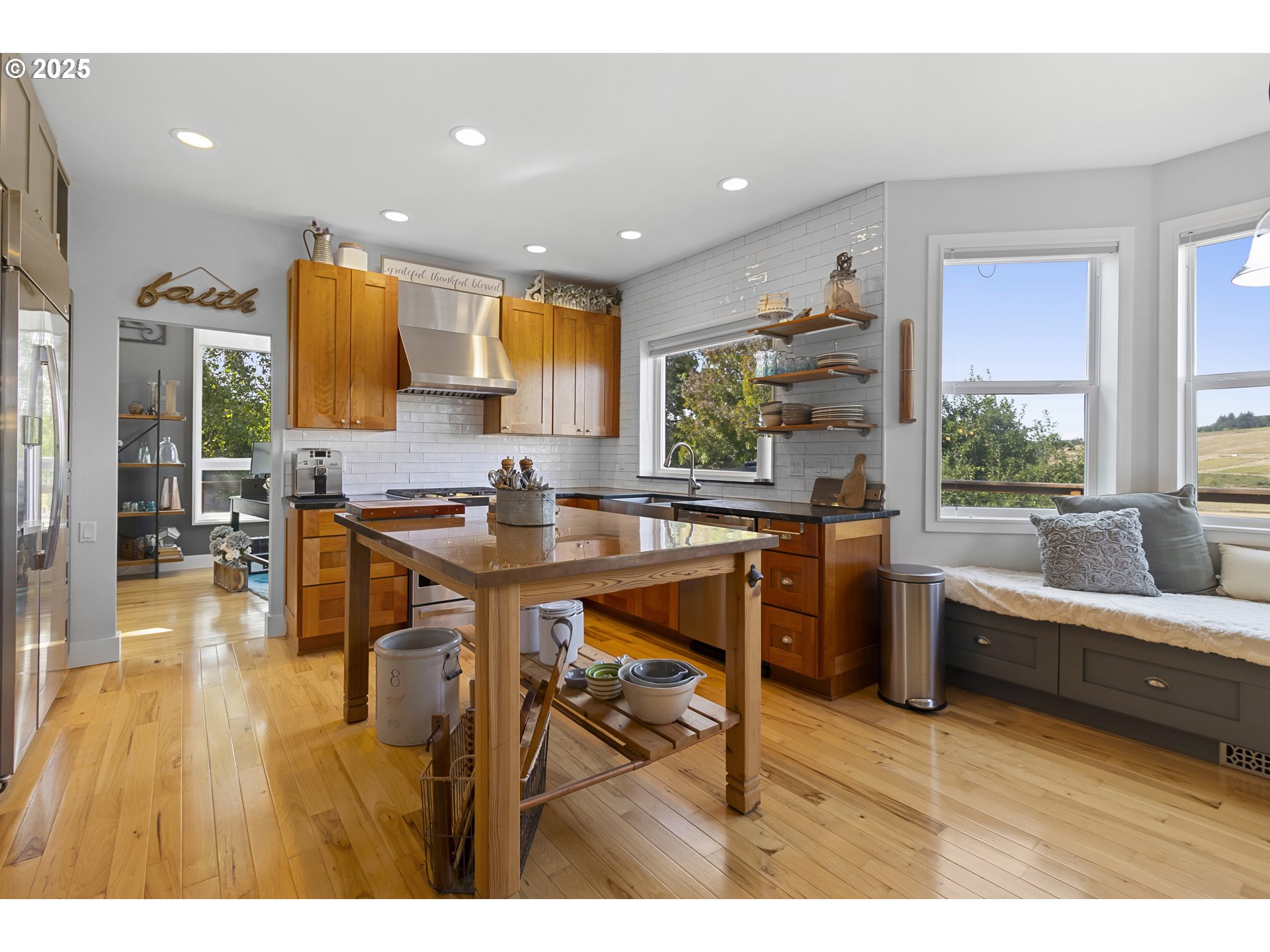 13631 Northeast Kinney Road Newberg, OR 97132 - Photo 9 of 48 a kitchen with stainless steel appliances granite countertop sink stove and wooden cabinets